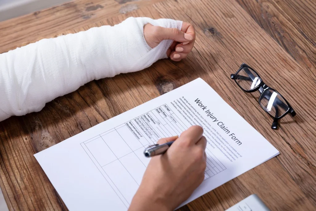 injured-woman-filling-work-injury-claim-form